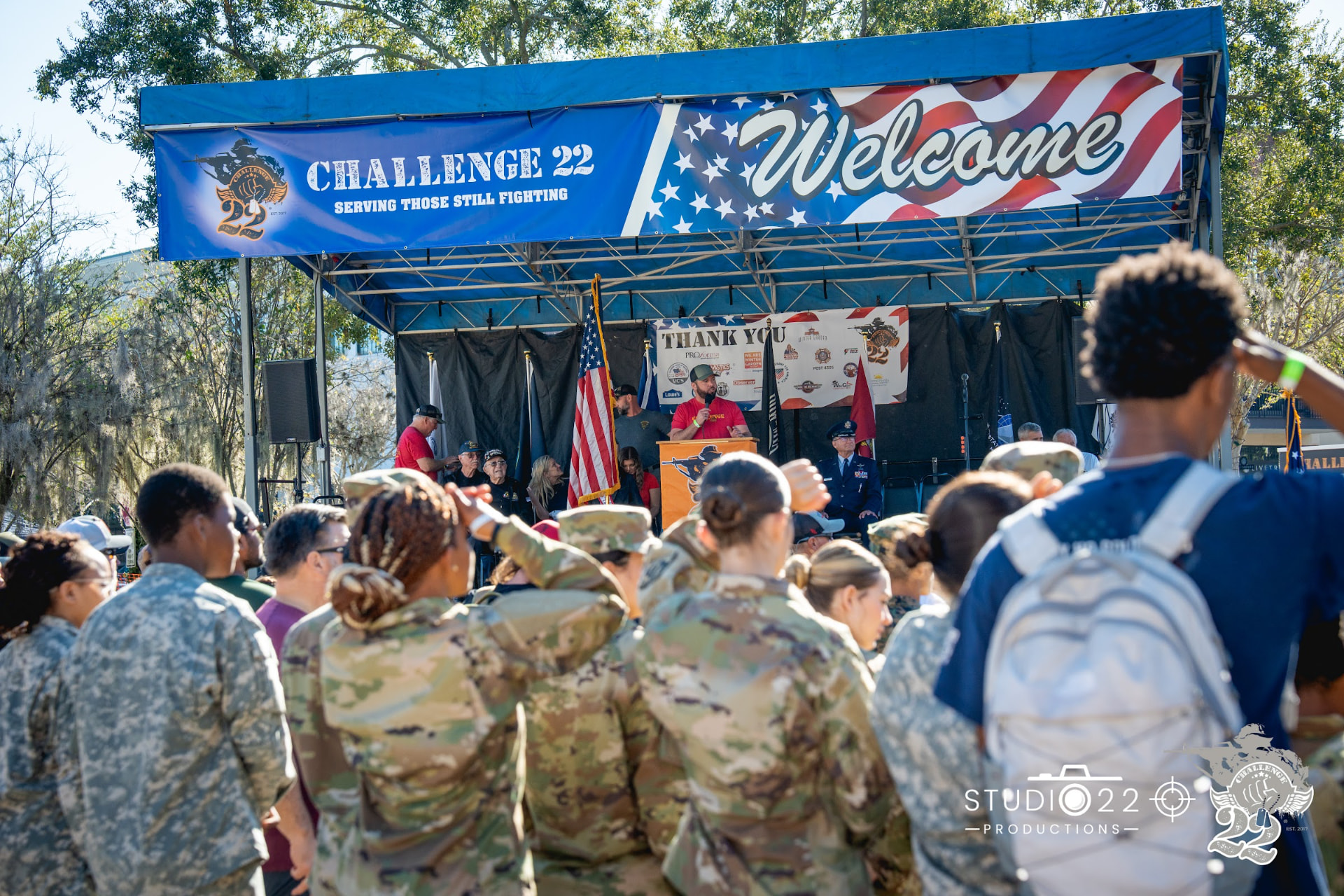 Austin Arthur speaking on stage at a Challenge 22 to End Veteran Suicide event