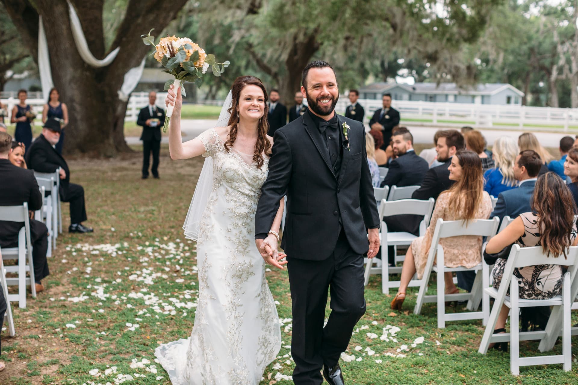 Austin Arthur and his wife Kellie Arthur walking down the aisle on their wedding day