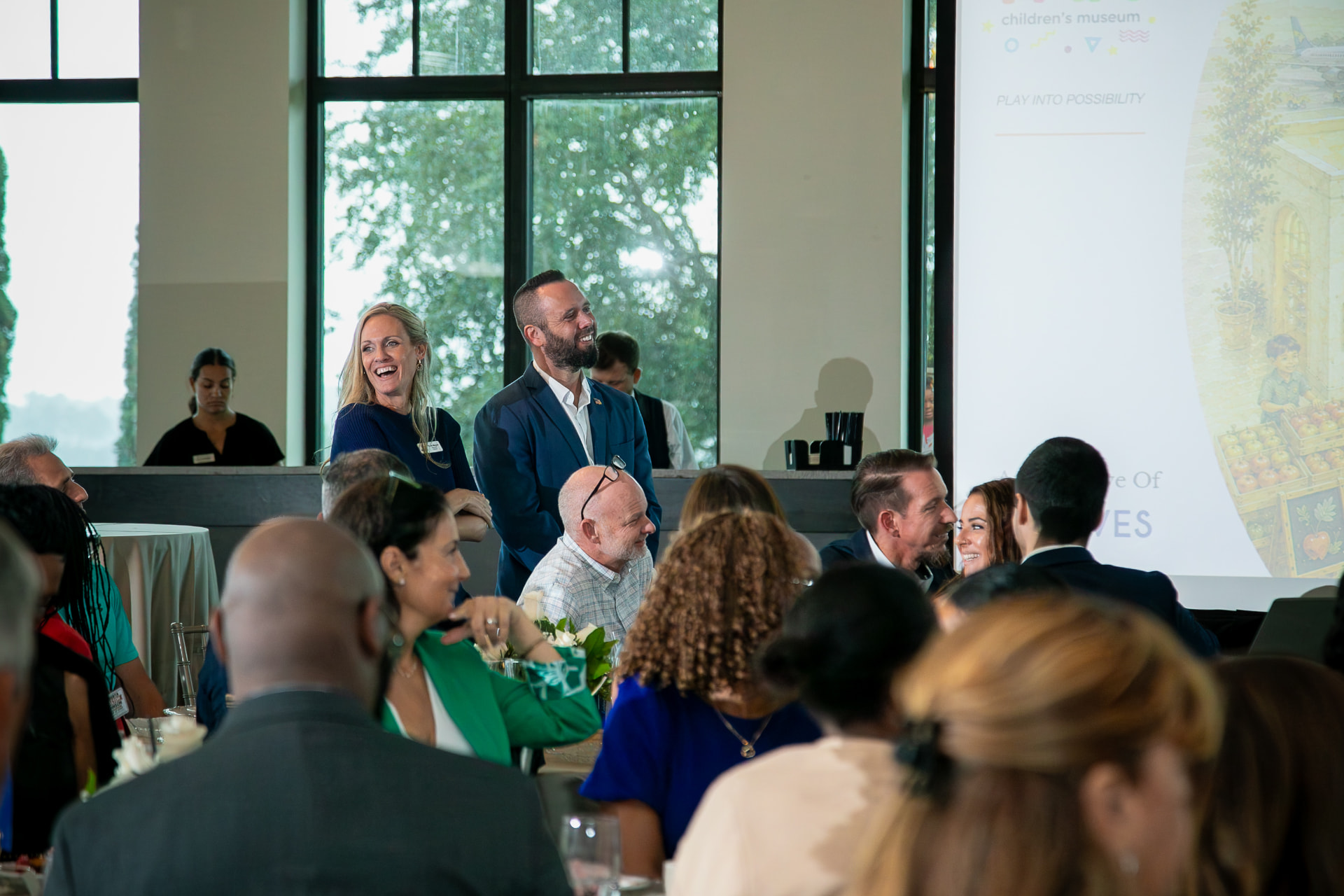 Austin Arthur listening during the I AM Children's Museum presentation at the 2026 8 Waves WaveMaker Luncheon