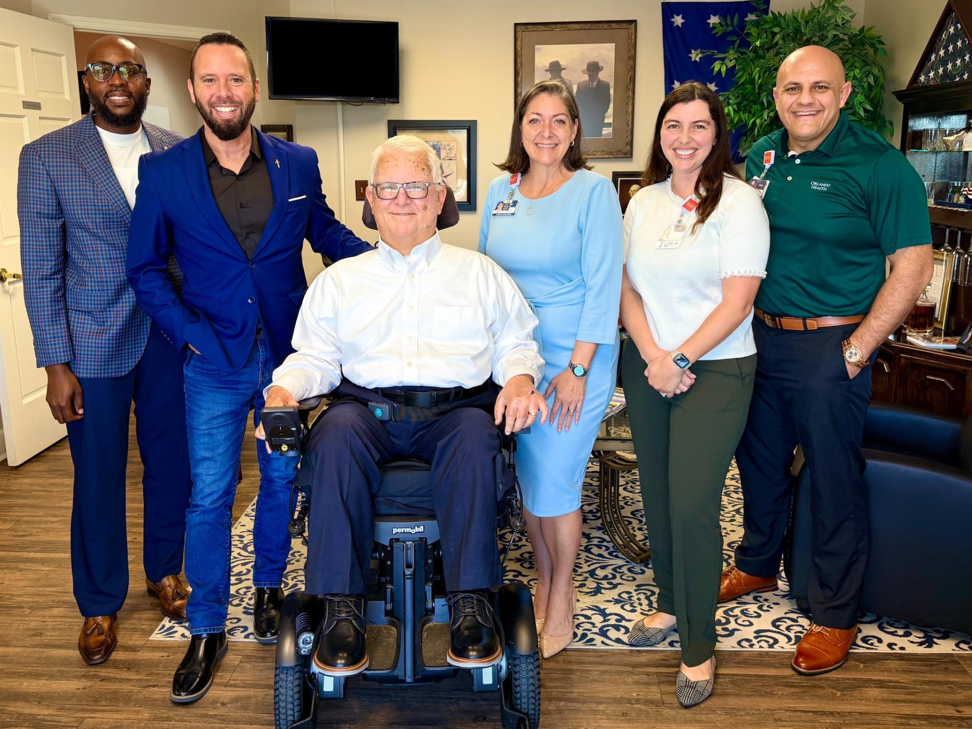 Austin Arthur with Lift Disability Network founder Jim Hukill and the Orlando Health team