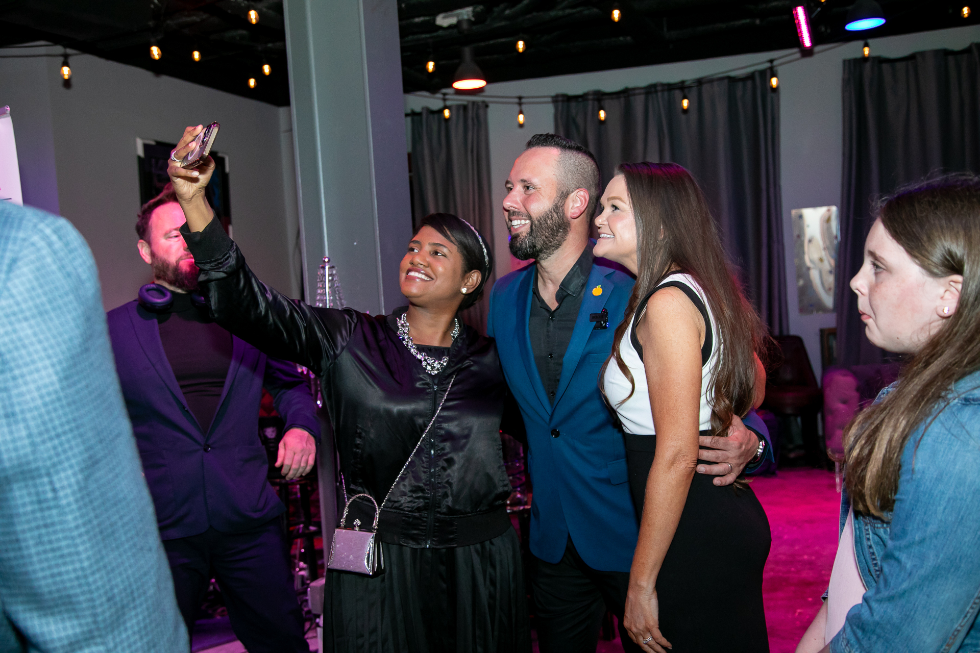 Austin and Kellie Arthur taking a selfie with supporters