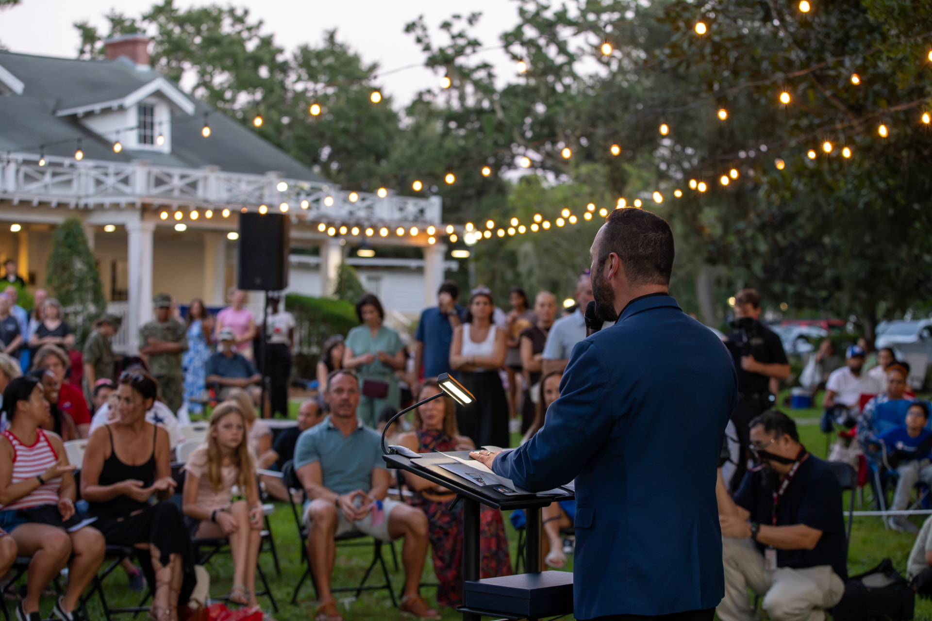 Austin Arthur addressing neighbors at Rise Up: America 250 in Motion in Windermere, Florida