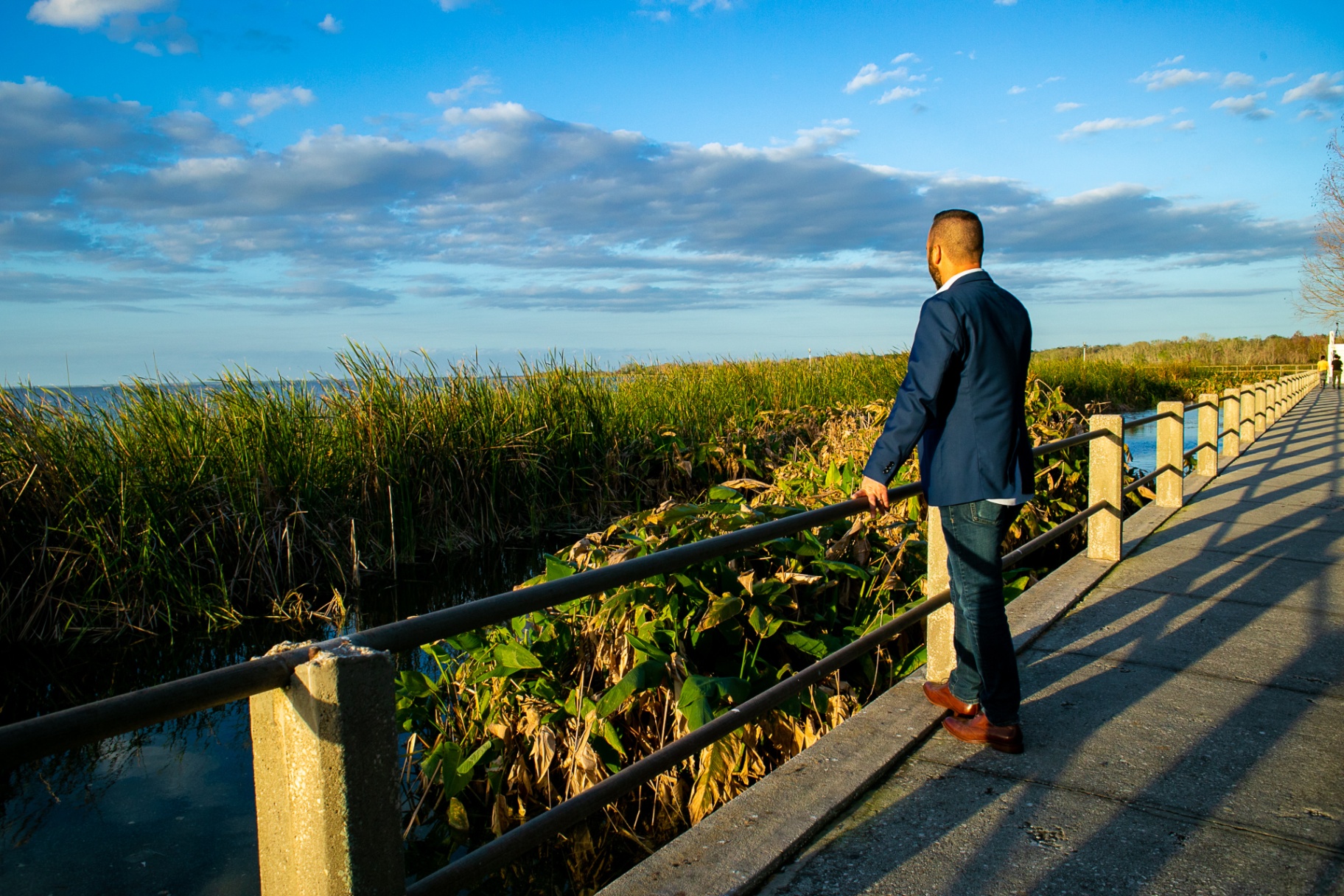 Austin Arthur looking out over Lake Apopka at sunset