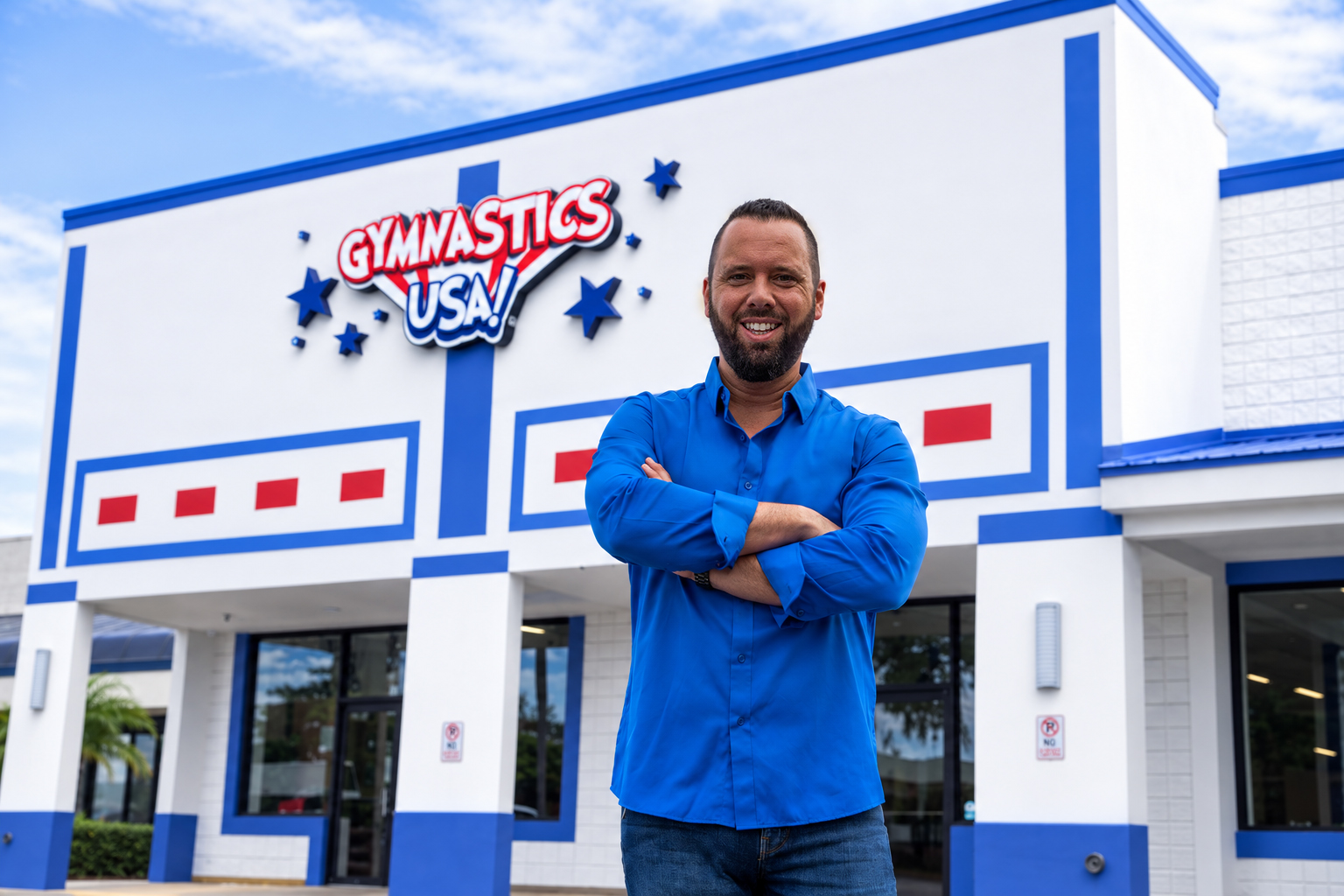 Austin Arthur standing in front of Gymnastics USA in Winter Garden