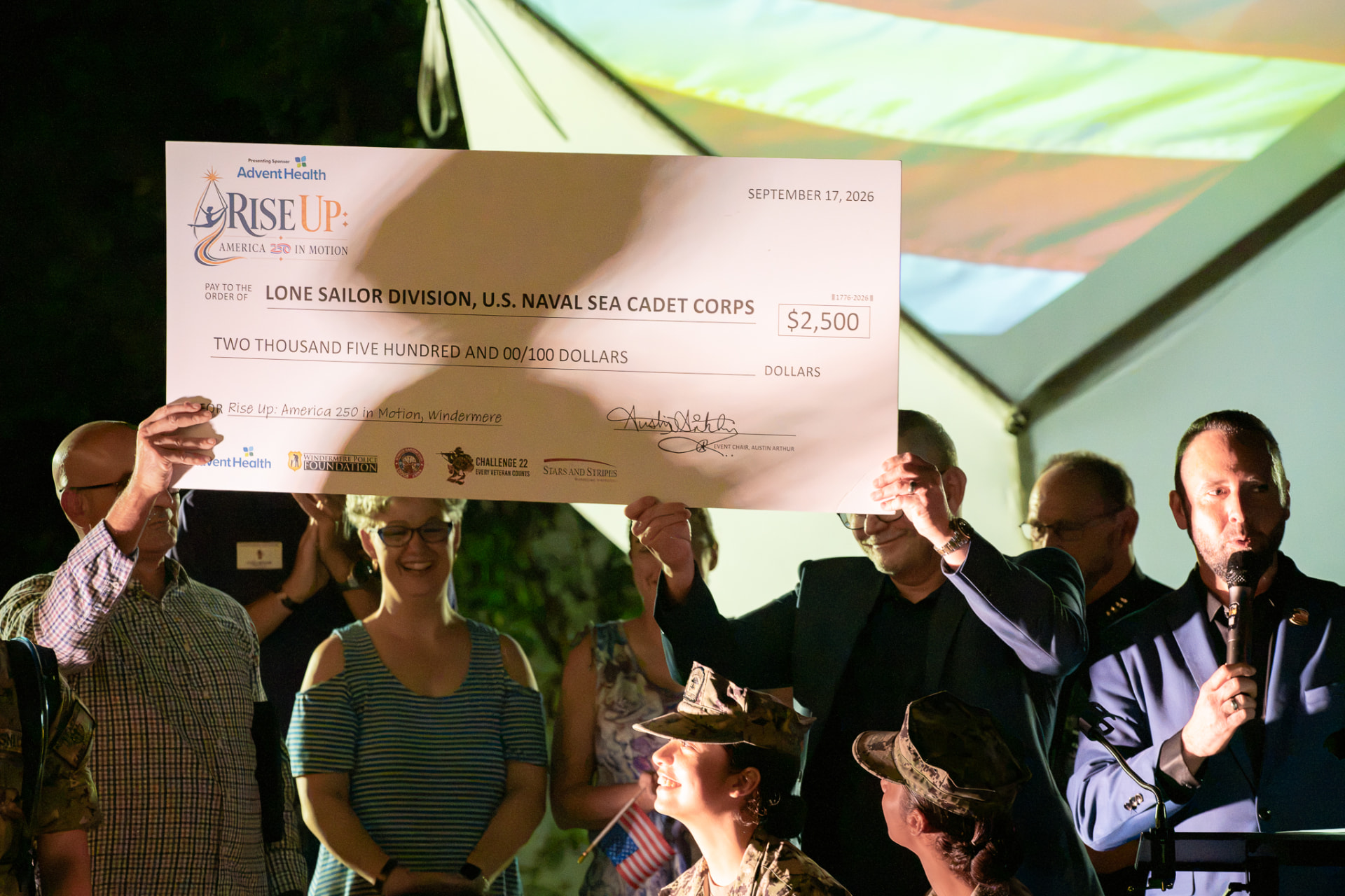 America 250 partners presenting a $2,500 donation to the Lone Sailor Division of the U.S. Naval Sea Cadet Corps in Windermere