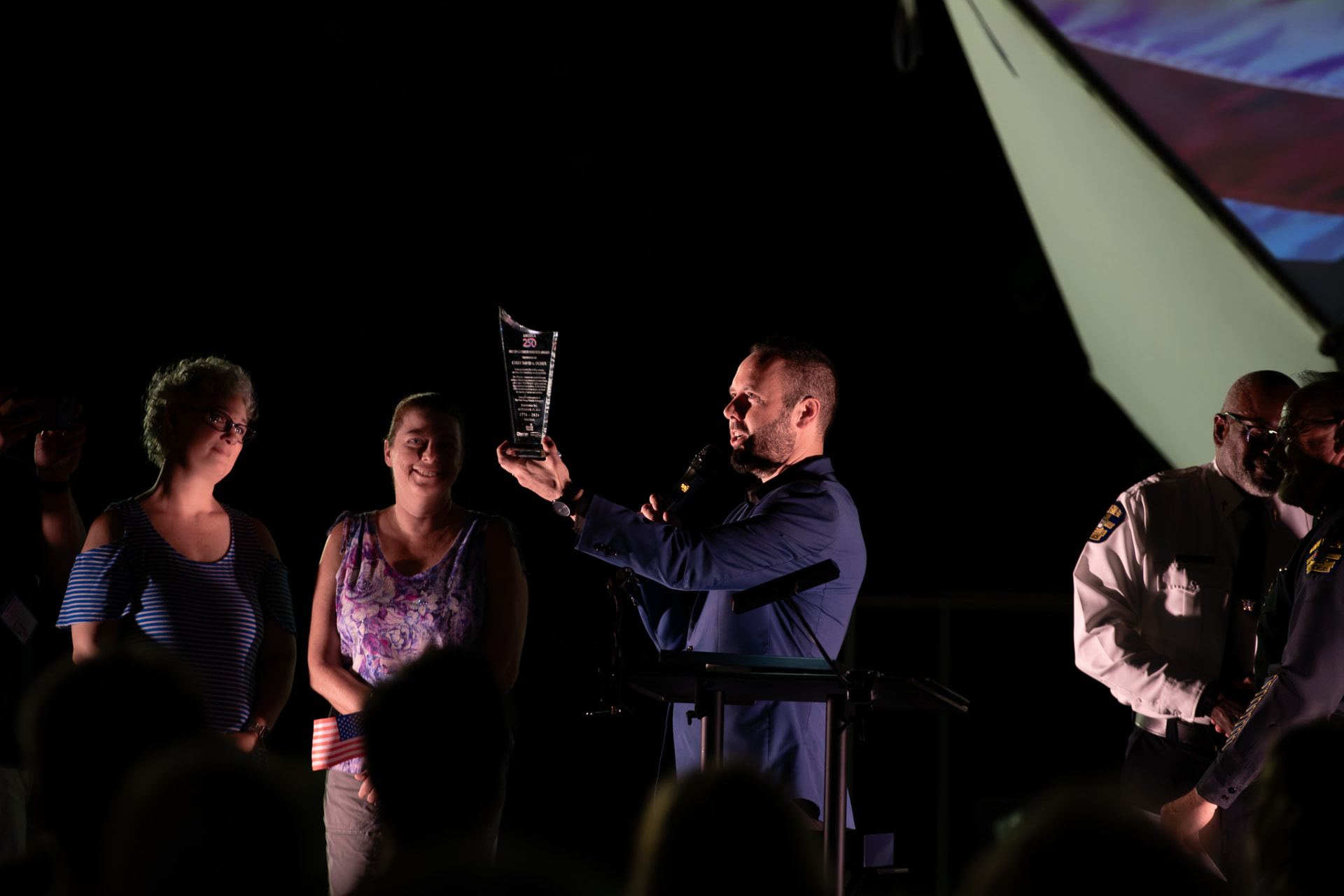 Austin Arthur presenting the America 250 Achievement Award at the ceremony